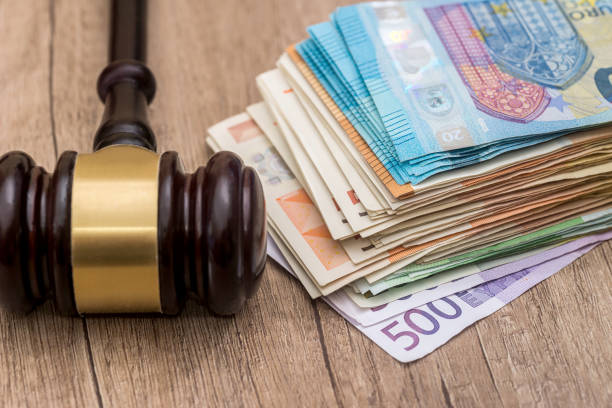 istock Wooden hammer on euro banknotes close up 924779552
