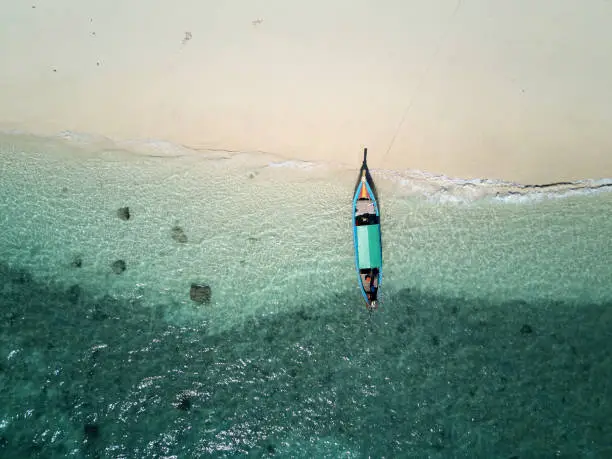 Aerial View. Top view of Thai traditional longtail boat anchored on the beach