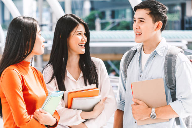 istock Group of students holding notebooks outdoors.Education concept 924784756