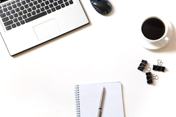istock Office workplace with laptop, cup of coffee, accessories on white. Top view with copy space. 924786208