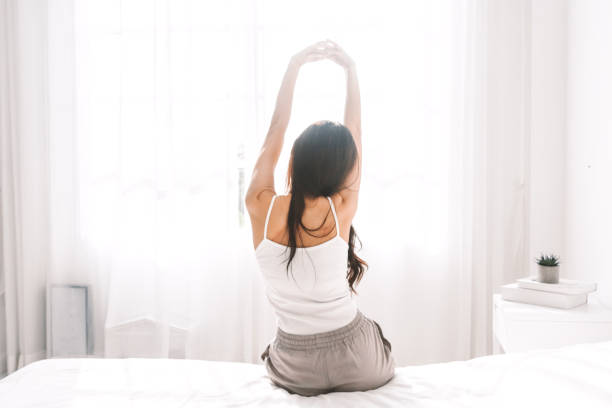 istock Woman stretching in bed after wake up 924793208