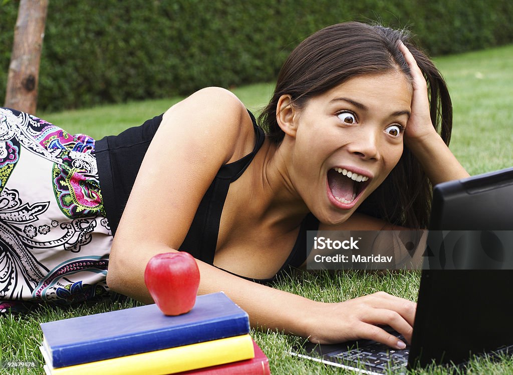 surprised student on laptop  Females Stock Photo