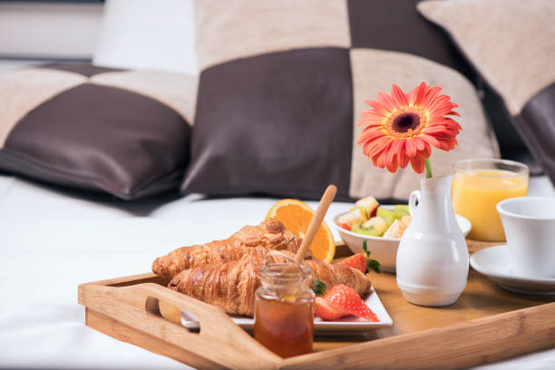 istock Tray with breakfast food on the bed inside a bedroom 924796308