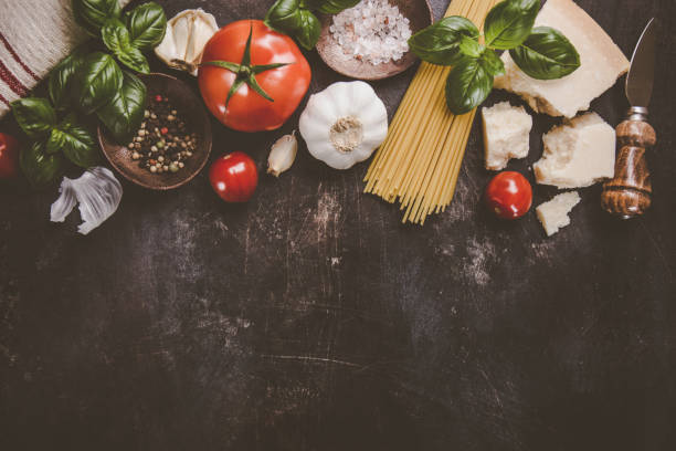 istock Top view of different vegetables and products for pasta making on rough table. 924797794
