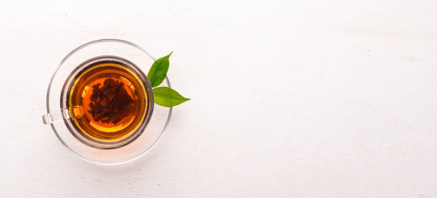 istock A cup of black tea on a wooden background. Top view. Copy space. 924797850