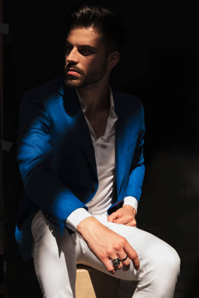 istock man looks away with ray of light on his face 924801112