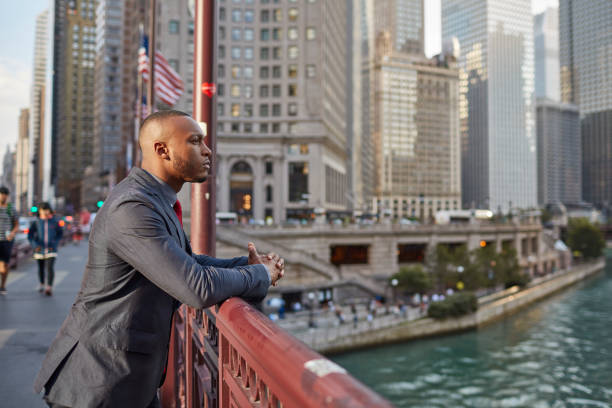istock Confident businessman standing on bridge in city 924801818