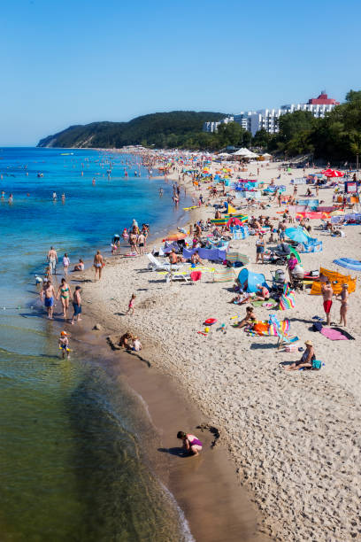 26th.April 2018 La Côte Méditerranéenne, Mediterranean Sea, Côte d'Azur, French Riviera, Provence France. Tourists and families are sunbathing and swimming at the beach resort Nr. Nice and Cannes. It is a hot sunny summers day with a clear blue sky.