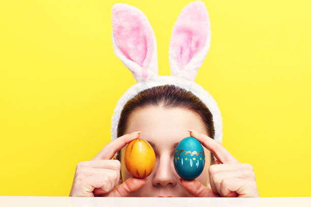 istock Happy young woman wearing bunny ears 924805996