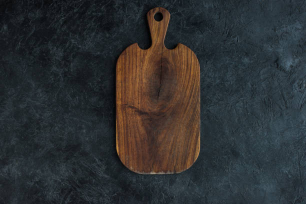 istock top view of empty wooden cutting board on dark tabletop 924806022