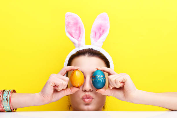 istock Happy young woman wearing bunny ears 924806026