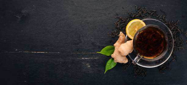 istock Tea with lemon and ginger. Hot drink On a wooden background. Top view. Copy space. 924806060