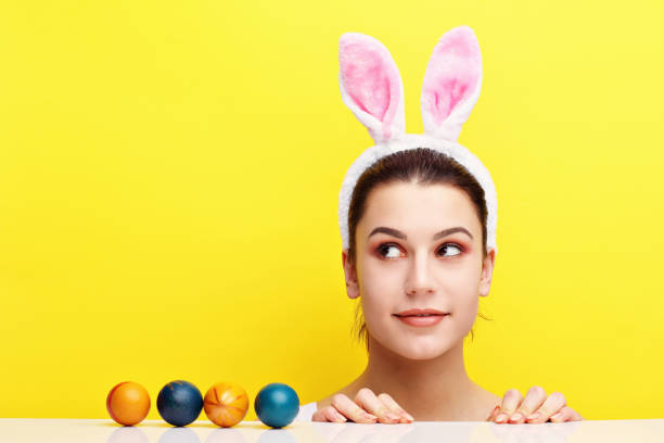 istock Happy young woman wearing bunny ears 924806078