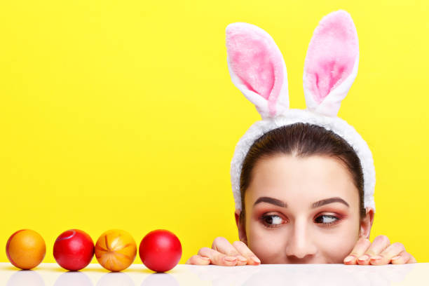istock Happy young woman wearing bunny ears 924806122