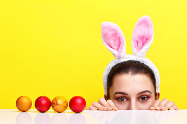 istock Happy young woman wearing bunny ears 924807380