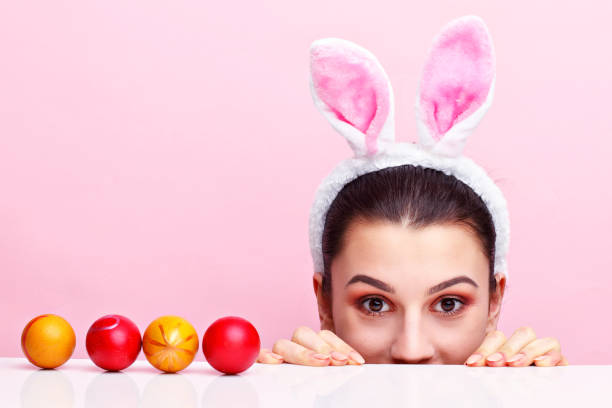 istock Happy young woman wearing bunny ears 924808170