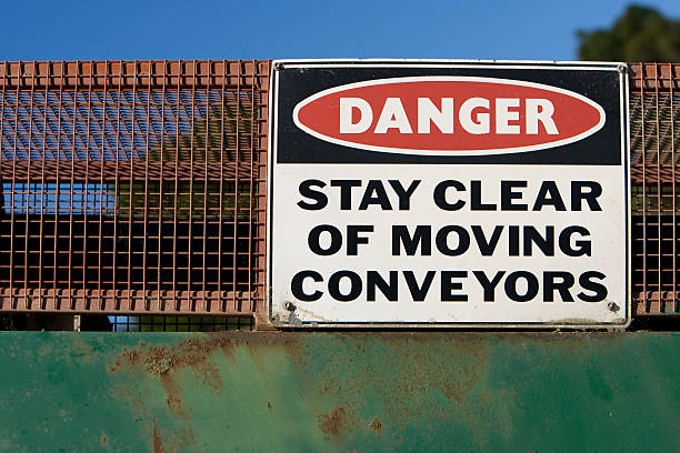 istock Danger conveyor sign on side of a machine 92480903