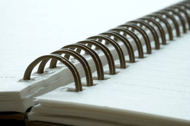 istock Extreme closeup of a spiral notebook closeup notepad as mockup for your design. 924809748