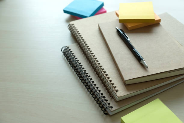 istock Top view of businessman  blank notebook business document black pen 924809754