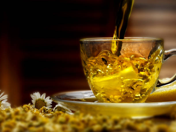istock hot chamomile tea poured into a glass cup 924813326