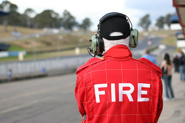 istock Fire marshall at race track watching race from the pits 92481562