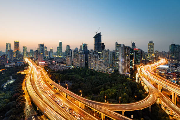 istock Modern city with highway interchange in Shanghai, China. 924817484