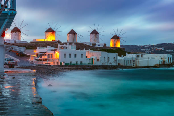 istock Traditional windmills at sunrise, Santorini, Greece 924817610