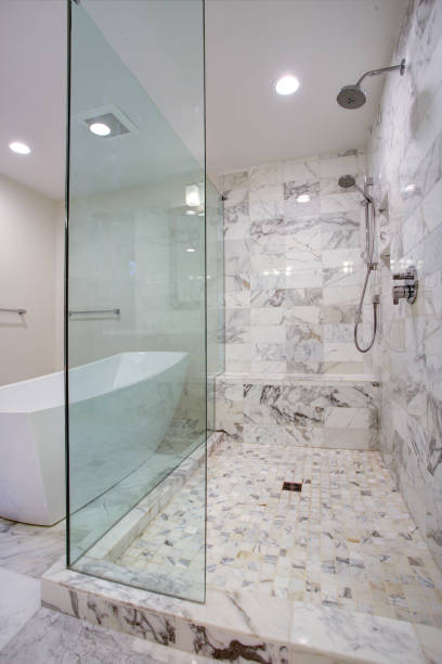 istock Sleek bathroom with large walk in shower 924824494