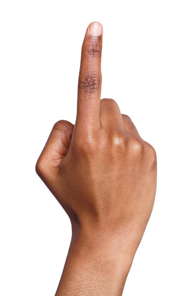 Black hand shows number one isolated Black female hand shows number one isolated, closeup. Counting gesturing, enumeration, white background index finger stock pictures, royalty-free photos & images