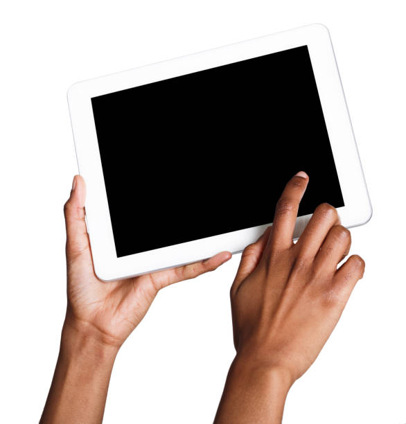 istock Holding and pointing to blank screen on tablet 924828574