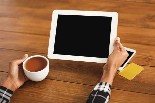 istock Black woman pointing with finger on digital tablet 924829258