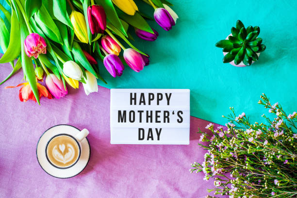 istock Happy mother's day written in lightbox with spring flowers from above 924833230