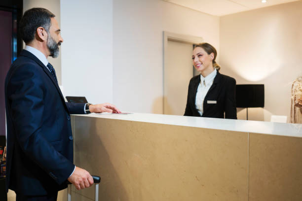 istock Business man at reception desk 924836990