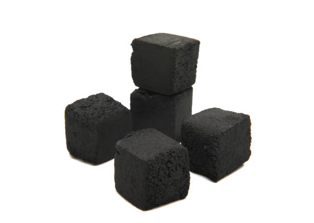 istock Cubes of coconut coal for a hookah on a white background. 924844392