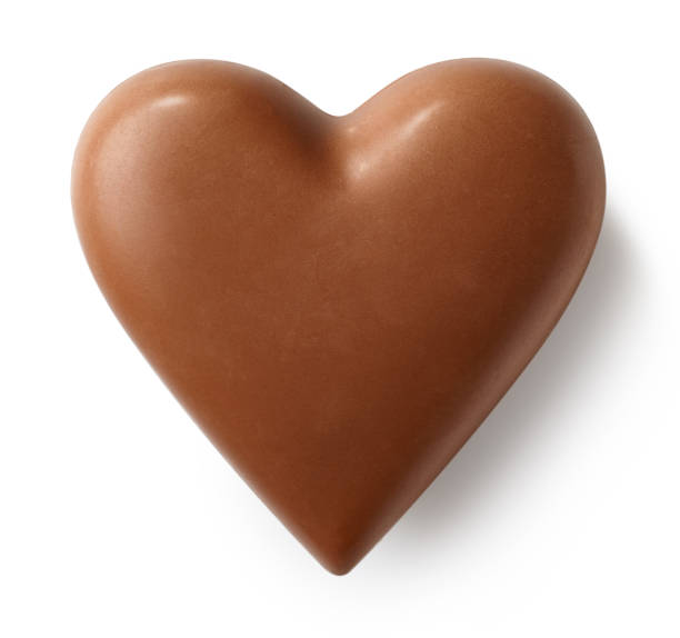 milk chocolate heart on white background - heart shape snack dessert symbol imagens e fotografias de stock