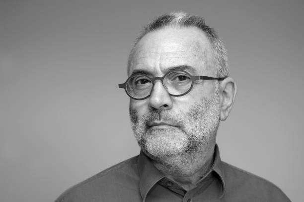 istock middle-aged man with blue shirt and glasses 924853466