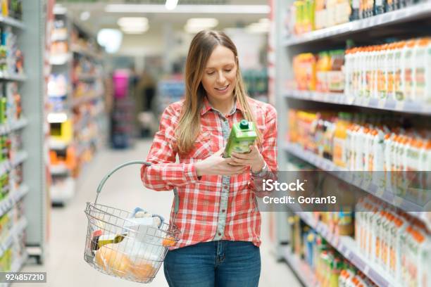 Young Woman Shopping Groceries Stock Photo - Download Image Now - Shopping, Supermarket, Juice - Drink