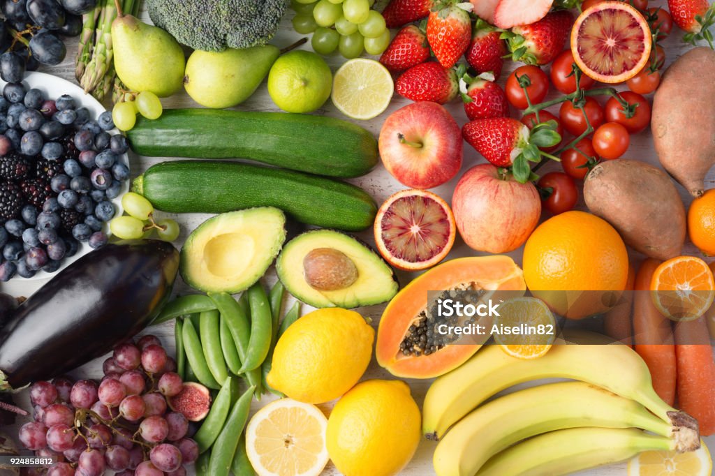 Rainbow fruits and vegetables, top view Healthy eating, assortment of fruits and vegetables in rainbow colours background, top view, selective focus Fruit Stock Photo