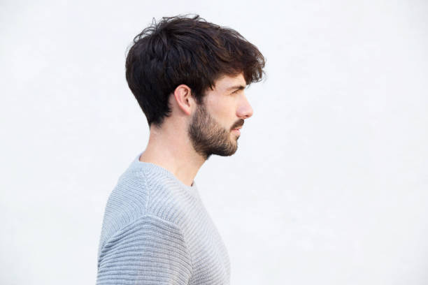 istock Close up profile handsome young man by white wall 924861518