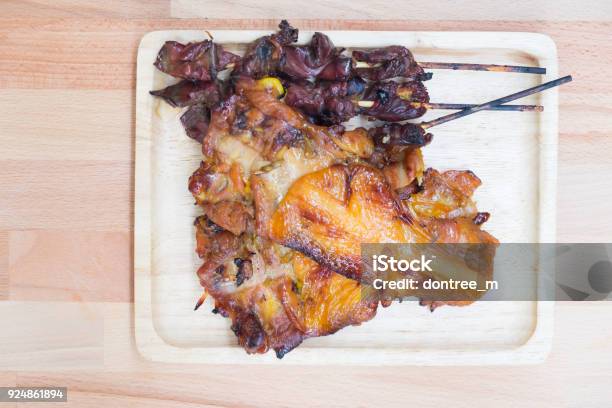 Thai Style Barbecue Chicken Meat And Entrails On Wood Tray Stock Photo - Download Image Now