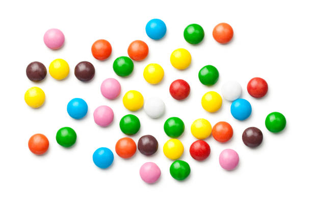 istock Colorful Chocolate Candy Pills Isolated on White Background 924862852