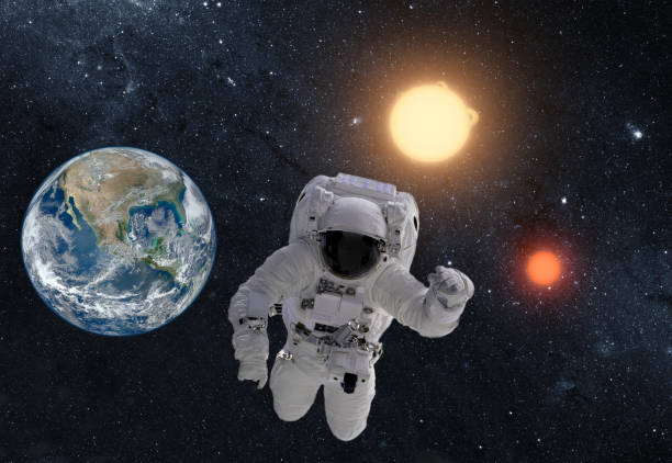 istock Astronaut in outer space over the planet earth. This image is a collage of different images furnished by NASA 924867152