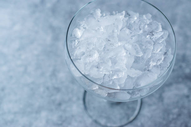 istock Crushed Ice in Cocktail Glass on Blue Surface. 924877330
