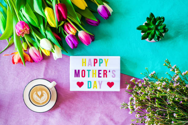istock Happy mother's day written in lightbox with spring flowers from above 924877738