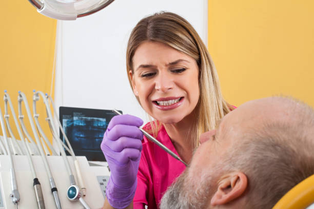 istock Female dentist examining patient 924882432