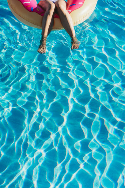istock Woman resting on inflatable during vacation 924894046
