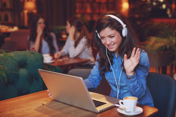 istock Young woman making video call in cafe 924895308