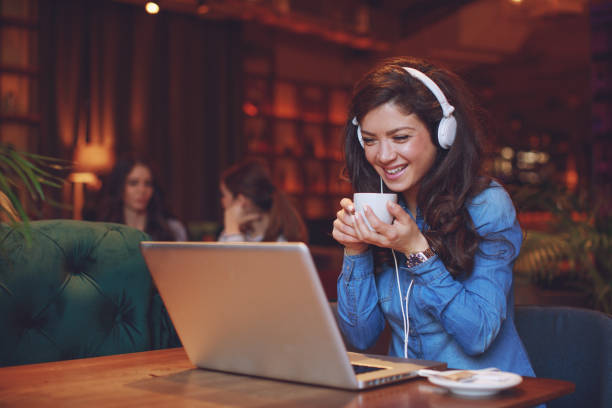 istock Young woman making video call in cafe 924896008