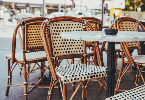 Empty chairs in a restaurant on the streets of Paris