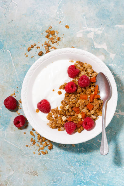 istock granola with dried apricots, raspberries and yogurt for breakfast 924898590